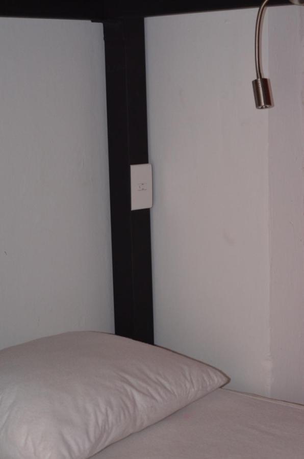 Cama en habitación compartida de 8 camas